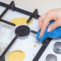remove burnt on grease from stove top