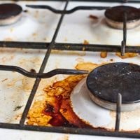 how to remove burnt on grease from stove top